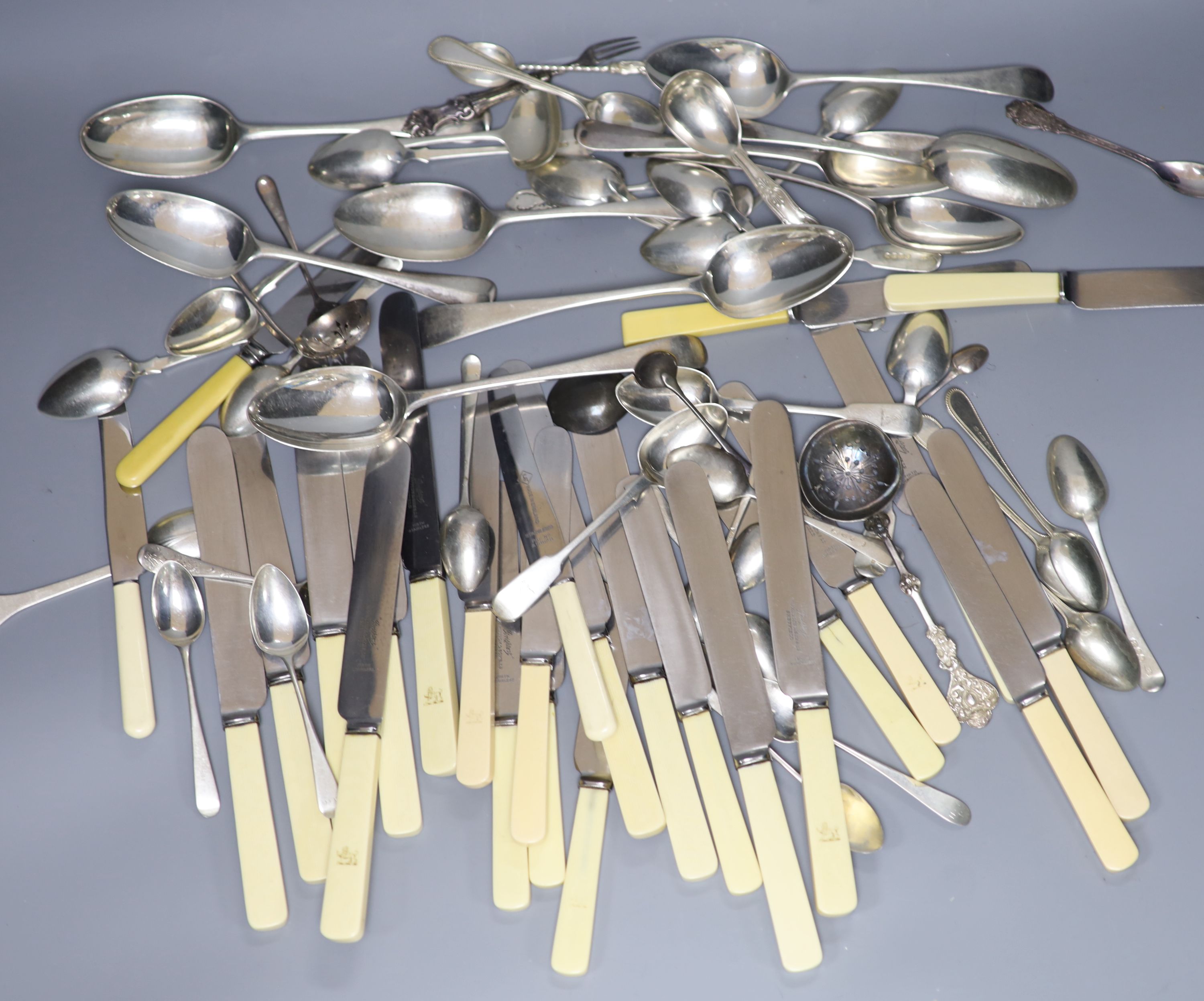 Eleven Victorian silver fiddle pattern teaspoons, a quantity of minor silver flatware, ten assorted 18th/19th century silver tablespoons, a small group of plated flatware and a group of assorted ivorine handled table and